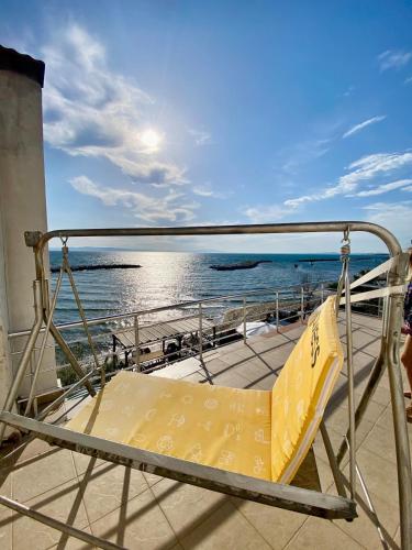a bed on the deck of a boat in the ocean at Ayvalik Seafront Villa Mansion Summer House in Ayvalik in Ayvalık