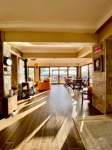 a large living room with a couch and a table at Ayvalik Seafront Villa Mansion Summer House in Ayvalik in Ayvalık