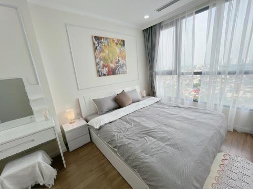 Ένα ή περισσότερα κρεβάτια σε δωμάτιο στο Dani Apartment - Vinhomes Times City - Hà Nội