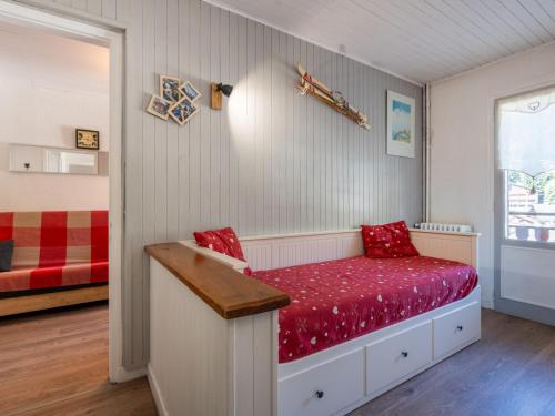 En eller flere senge i et værelse på Appartement au cœur de La Clusaz, animaux acceptés - FR-1-304-7