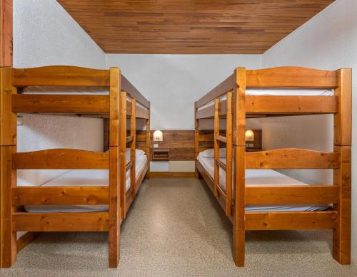 Ένα ή περισσότερα κρεβάτια σε δωμάτιο στο Chalet les arolles