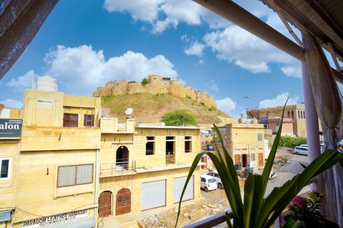 a view of a city with a castle on a hill at Hotel The Surya Jaisalmer in Jaisalmer
