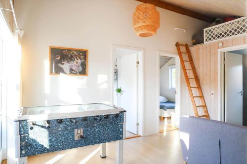 a room with a large aquarium in the middle of a room at 13393-1-Vig-Lyngtoftevej-9-D in Vig