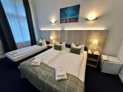 Postel nebo postele na pokoji v ubytování Hotel Seifert Berlin am Kurfürstendamm