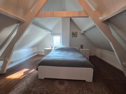 Ένα ή περισσότερα κρεβάτια σε δωμάτιο στο Het Boerengenieten