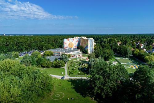 an aerial view of a building in a park at AHORN Seehotel Templin in Templin