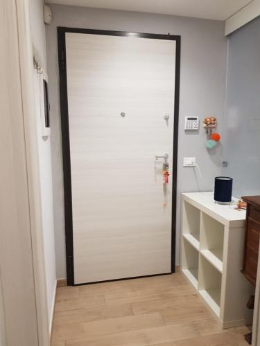a sliding glass door in a bathroom with a sink at Casa Angelina in Acireale