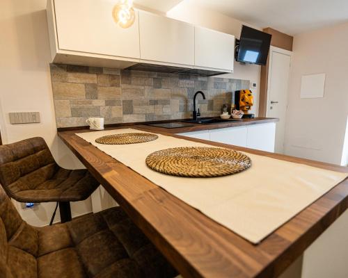 a kitchen with a counter top with a plate on it at Luna Gemella Suite & SPA in Calitri
