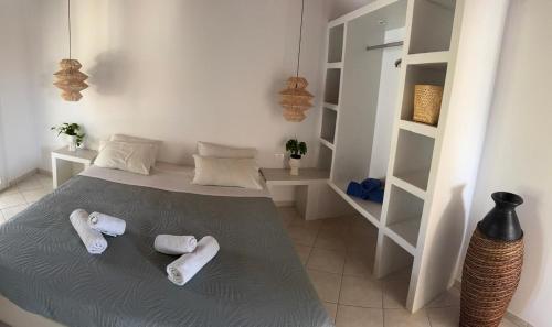 Ένα ή περισσότερα κρεβάτια σε δωμάτιο στο Nafsika Residences