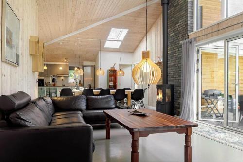 a living room with a couch and a table at 8839-Glesborg-Zachosvej-1-A in Glesborg
