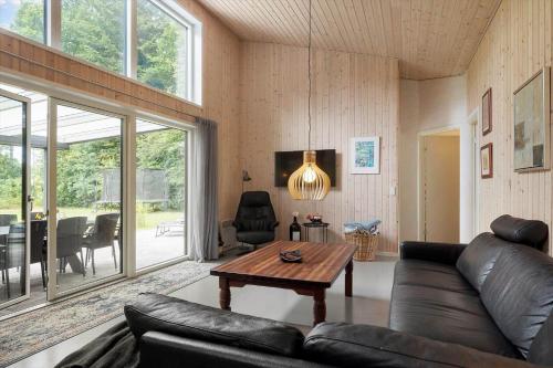 a living room with a couch and a table at 8839-Glesborg-Zachosvej-1-A in Glesborg