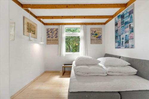 a living room with a couch and a window at 8554-Grenaa-Bertavej-25 in Brøndstrup
