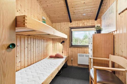 a small room with a bunk bed in a tiny house at 8531-Grenaa-Annettevej-9 in Brøndstrup