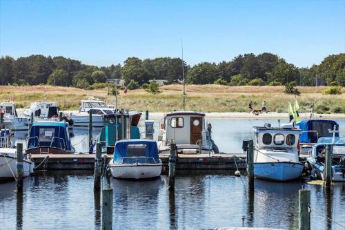 a group of boats docked at a dock in the water at 8503-Grenaa-Ellevej-29 in Grenå