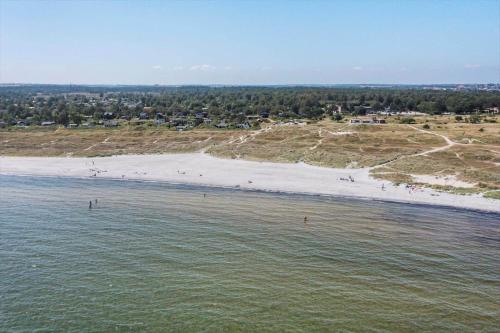 an aerial view of a beach with people in the water at 8522-Grenaa-Nobilisvej-15 in Grenå