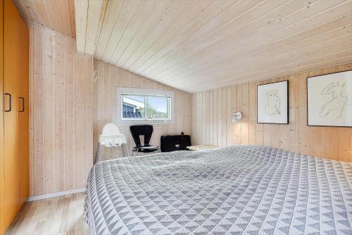 a bedroom with a bed and a window at 8533-Grenaa-Fridavej-2 in Brøndstrup