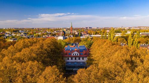 an aerial view of a city with a building at Hotel Gorczowski Katowice Chorzów in Chorzów