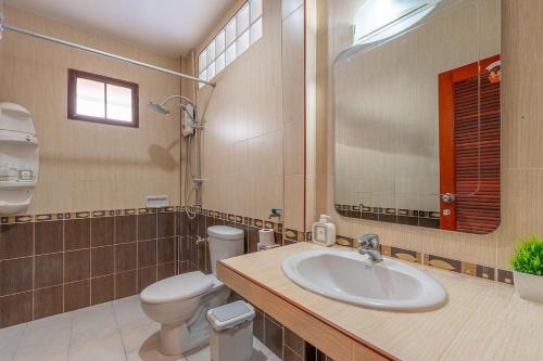 a bathroom with a sink and a toilet and a mirror at Serenity Holiday Villa 2, Karon Beach in Karon Beach