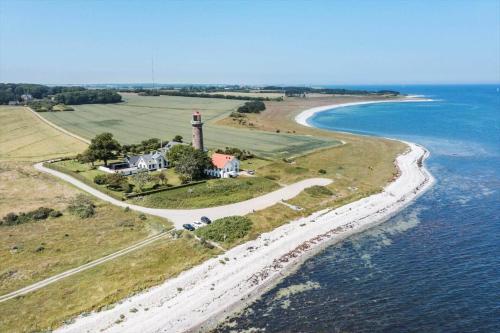 an aerial view of a lighthouse on an island in the ocean at 8514-Grenaa-Sortebaervej-16 in Grenå