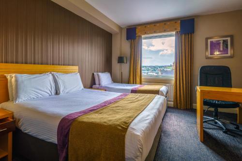 Letto o letti in una camera di City Hotel