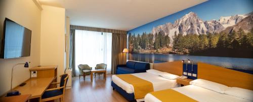 Ένα ή περισσότερα κρεβάτια σε δωμάτιο στο Hotel Express Aosta East