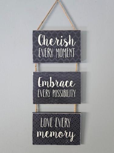 a group of signs that say cherish every moment and embrace every possibility at Peace of Mind Loft in Rochester
