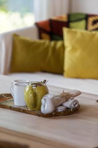 a tray with a tea pot and cups on a table at 1497-N-Gilleleje-Parcelvej-3 in Gilleleje