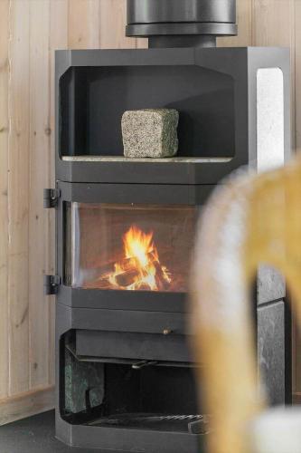 a stove with a fire inside of it at 1497-N-Gilleleje-Parcelvej-3 in Gilleleje