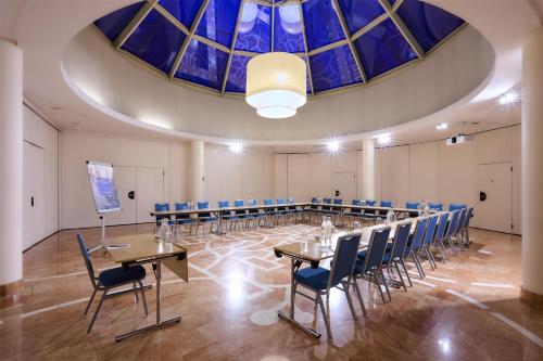 a conference room with a long table and chairs at Radisson Blu Sobieski in Warsaw