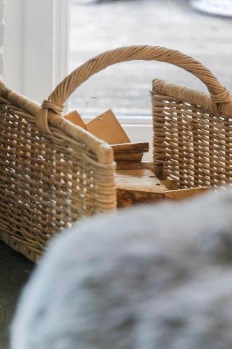 a wicker basket sitting on top of a table at 1587-Tisvildeleje-Stuebjergsvinget-3 in Tisvildeleje