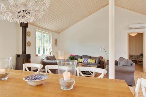 a living room with a table and a dining room at 902-N-Tisvildeleje-Klovervej-9 in Tisvildeleje