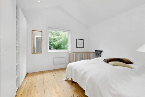 Ένα ή περισσότερα κρεβάτια σε δωμάτιο στο 888-Tisvildeleje-Sankt-Helene-Vej-14