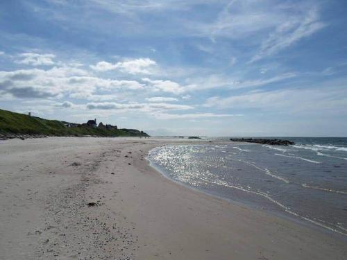 a beach with the ocean and a cloudy sky at 1606-Liseleje-Lisevaenget-18 in Liseleje