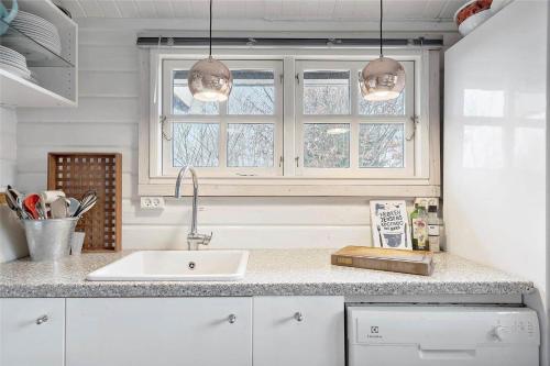 a kitchen with a sink and a window at 1401-N-Liseleje-Korntoften-9 in Liseleje