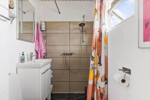 a bathroom with a sink and a shower at 1648-Gilleleje-Dyrholmen-39 in Gilleleje