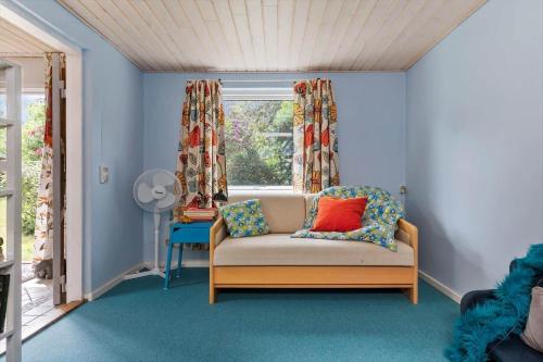 a living room with a couch and a window at 1648-Gilleleje-Dyrholmen-39 in Gilleleje