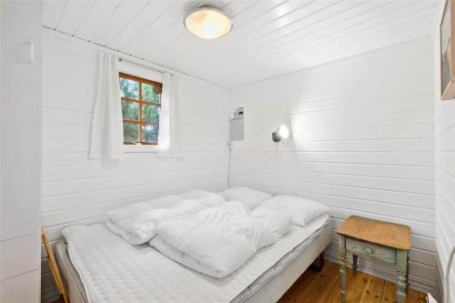 a bed in a white room with a window at 1139-N-Liseleje-Haldsvej-2 in Liseleje