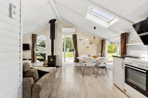 a kitchen and living room with a couch and a table at 1630-Frederiksvaerk-Munkebakken-2 in Frederiksværk