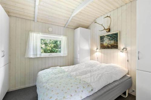 a bedroom with a bed in a room with a window at 617-N-Melby-Bakkely-8-B in Melby