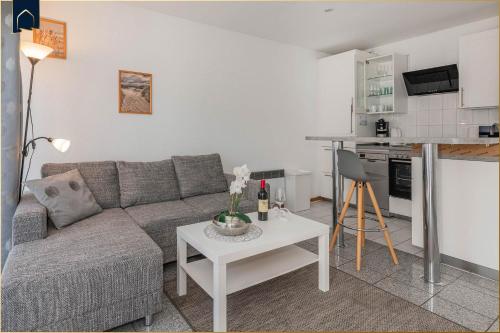 a living room with a couch and a table at Ferienanlage Bansin Seepferdchen 2 in Bansin