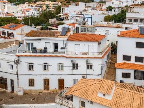 a group of white houses with orange roofs at T2 Apartment near the beach in Albufeira