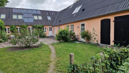 an external view of a house with a yard at Sandaasen Ecological Farm in Hillerød