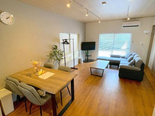 a living room with a table and a couch at Shibamata house self check in in Tokyo