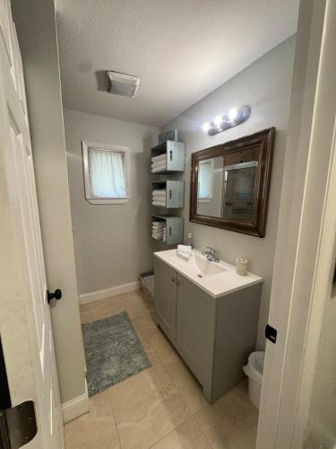 a bathroom with a sink and a mirror at Old Homosassa Living! Seconds to all the action! in Homosassa