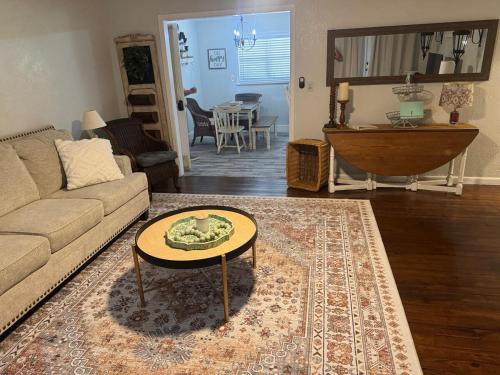 a living room with a couch and a table at Old Homosassa Living! Seconds to all the action! in Homosassa
