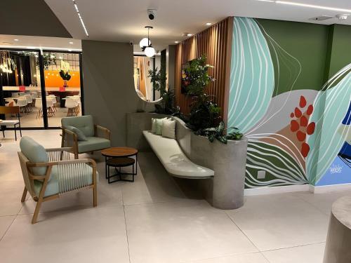 Et opholdsområde på Studio Helbor Stay Batel - Sofisticação, Conforto, Localização e Vista Privilegiada