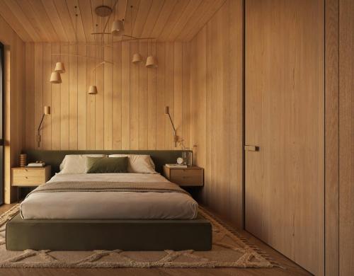 Un dormitorio con una cama y paredes de madera. en New designer cabin in Lofoten, en Storøya