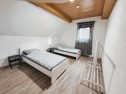 Ένα ή περισσότερα κρεβάτια σε δωμάτιο στο Neuhofen Stay