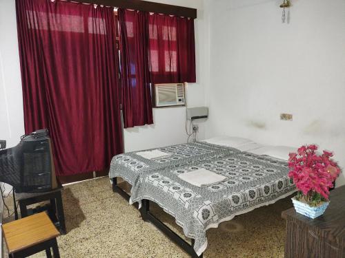 Katil atau katil-katil dalam bilik di Hotel Kismat Mahal