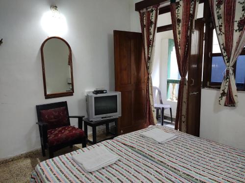 Katil atau katil-katil dalam bilik di Hotel Kismat Mahal